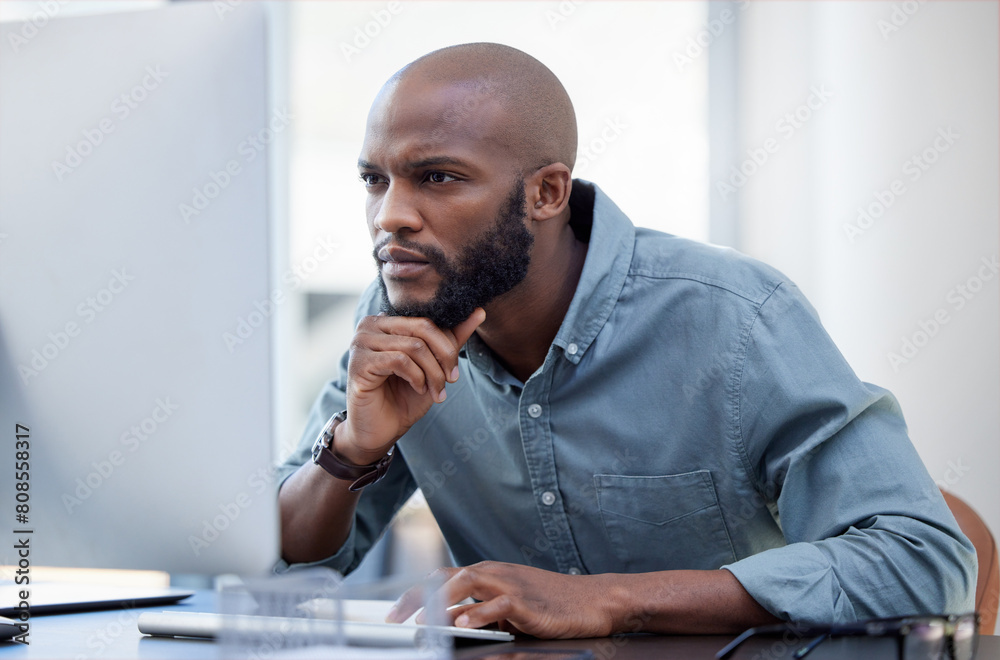Poster Man, working and thinking with computer in office, employee and online research for company on internet tech. Reading, thoughtful and planning for corporate work, problem solving and idea and desk