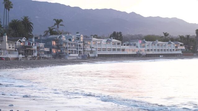 Beach Homes At Miramar Beach In Montecito, Santa Barbara, California. Ocean Waves Splashing In Foreground. wide shot