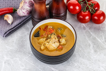 Traditional yellow Thai curry with chicken