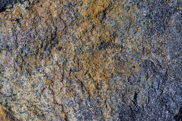 Natural pattern of the surface of andesite stone. Beautiful natural stone texture