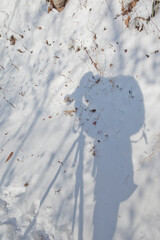 Human Shadow on Snowy Ground