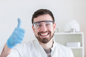 Scientist male with lab glasses working in a laboratory