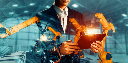 MLP Mechanized industry robot arm and factory worker double exposure. Concept of robotics...