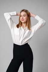 Young Woman in White Shirt Posing for Picture