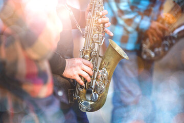 Musical instrument, saxophonist hands saxophonist playing jazz music Close-up of alto saxophone...