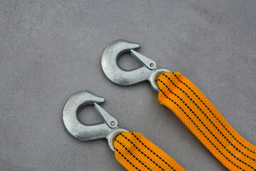 Towing strap on a grey background.