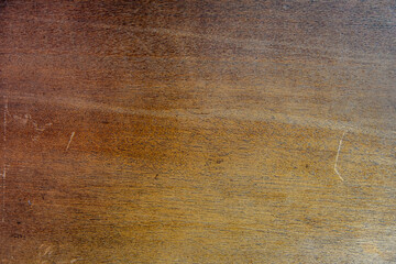 The image is of a wooden surface with a brownish color
