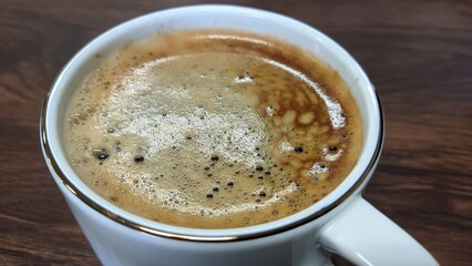 cup of americano with foam