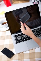 A close-up of bank CARDS and laptops