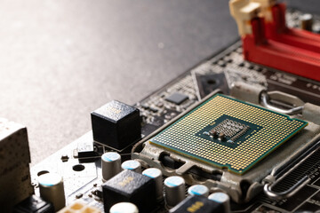 The technician is putting the CPU on the socket of the computer motherboard.