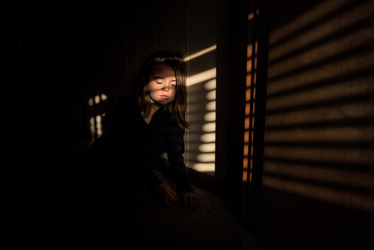 Beautiful girl resting in sun and shadows