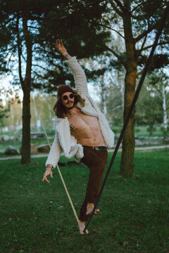 Young man practicing on a slackline