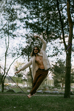 Young man balancing on slackline