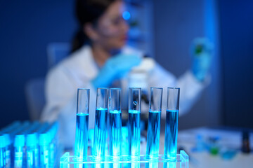 Scientists use scientific test tubes with records of chemicals or drugs being tested and examined...