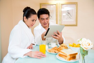 Husband and wife have breakfast in the restaurant