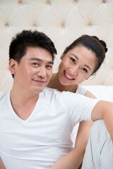 Fototapeta premium Husband and wife sat on the bed