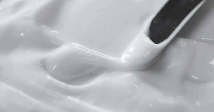 Motion of the Liquid cream, cosmetic texture , Top view. 
