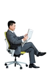 Shed on middle-aged business men sit chair reading a newspaper