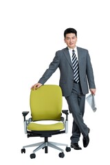 Shed middle-aged business man standing beside the chair
