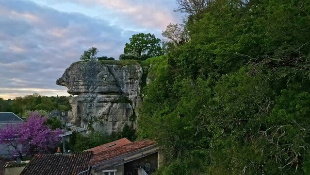 Poitiers rocky cliff and houses in France. Aerial backward