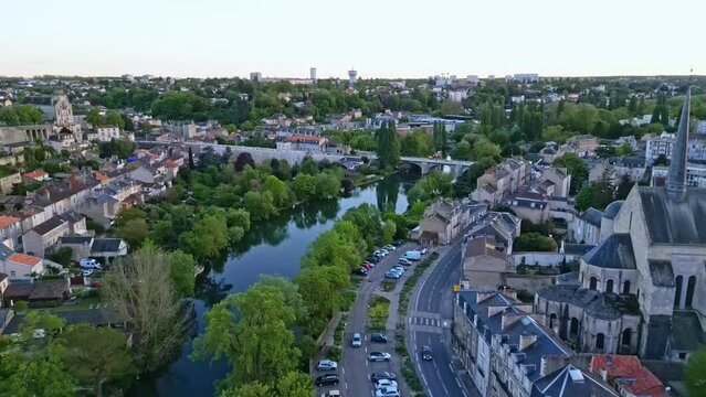 Church of Sainte-Radegonde near Clain river at Poitiers, France. Aerial forward