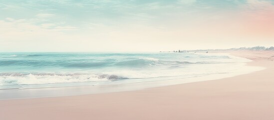Fototapeta premium Vintage toned abstract background of a serene beach with a smooth wave pattern providing ample copy space for images