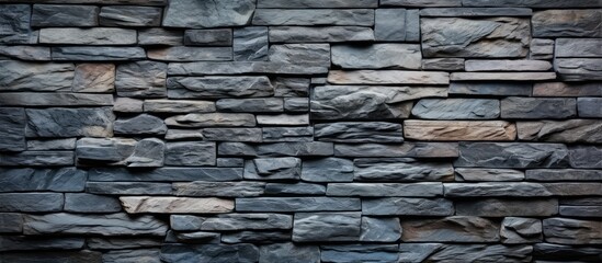 Horizontal textured background with a stacked slate stone wall as a copy space image