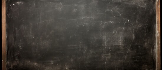 Obraz premium The blackboard displays a smudged chalk image. Copy space image. Place for adding text and design