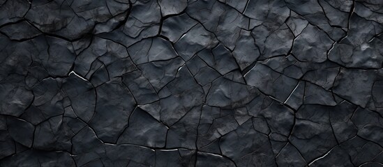 An image of a cracked asphalt texture perfect for use as a background with copy space - Powered by Adobe