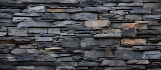 Horizontal textured background with a stacked slate stone wall as a copy space image