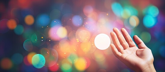 A male hand with an open palm is seen in the bottom left corner of the Rainbow Bubble Message Banner Template The background consists of a wide multicolored bubble bokeh providing space for text
