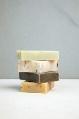 Handmade soap from natural ingredients, various herbs. Concept of sustainable use, bath products. Front view