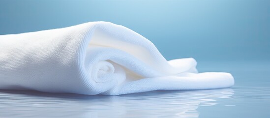 A pristine white towel with a soft and immaculate appearance. Copy space image. Place for adding text and design