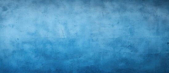 A textured blue painted wall provides a background with copy space image