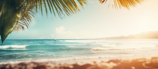 Fototapeta premium A vintage tone filter adds a touch of color to this abstract background featuring a blurred tropical beach bokeh sun rays and waves It creates a copy space image that conveys the essence of outdoor s