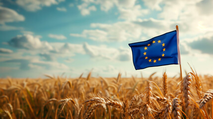 EU flag waving in golden wheat field, symbolizing agriculture in the European Union.
