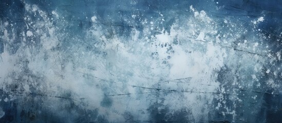 Abstract grunge background with splashes of white paint on a dark blue background providing ample copy space for an image