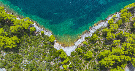 TOP DOWN: Aerial point of view of turquoise water at a remote beach in Korcula