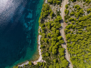 TOP DOWN: Coastal road runs through pine forest and along the turquoise Adriatic