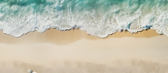 Naklejka na ściany i meble A top down view presents a sandy beach with clear sand texture along with exotic accessories This picturesque summer background offers ample copy space for products and mockups
