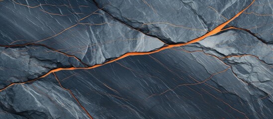 A nature background featuring a blue gray stone with white and orange patterned lines adding to its...