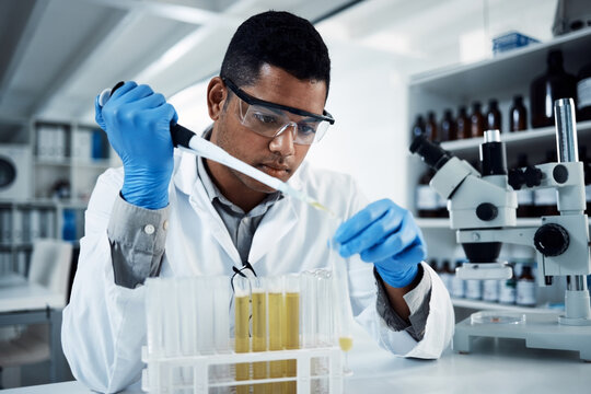 Indian man, liquid or scientist in laboratory for science innovation, life expectancy or antiaging medicine. Future, medical test or healthcare biologist with DNA chemistry, research or examination