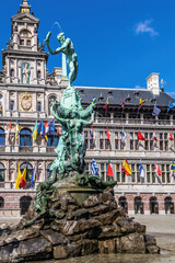 Brabo's monument with Stadhuis (City Hall) in the Grote Markt, Antwerp, Belgium