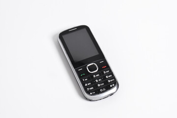 Old Mobile Phone isolated on white background. Classic mobile cell phone