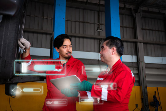 Car mechanic inspects car using technology and computer show resault at virtual screen.