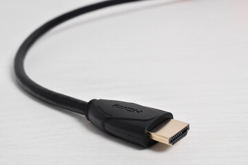 A close up of a HDMI cable connector on white background