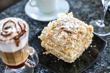 Black Plate With Cake and Cup of Coffee