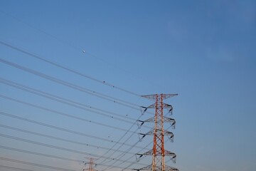 overhead electricity pylons. Lattice steel pylon. High voltage electricity tower. Silhouette High...