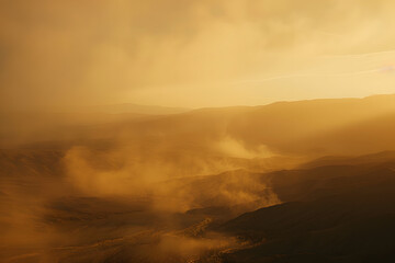 Naklejka na ściany i meble Misty golden sunset over layered hills