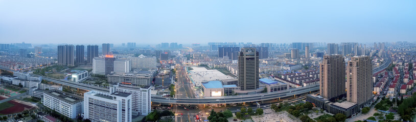 Modern Cityscape at Twilight: Urban Skyline Panorama